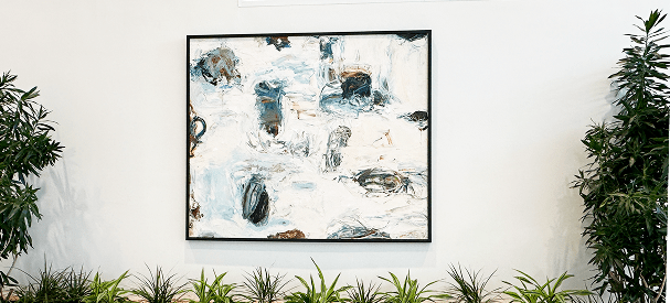 Abstract painting with green plants below