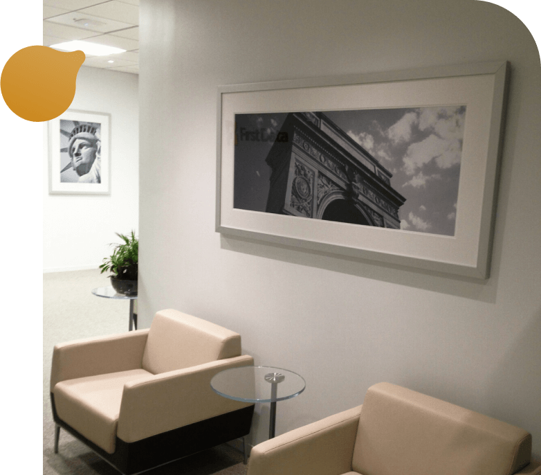 A building featuring a large mural of a man on its exterior wall.