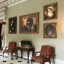 Elegant room with framed portraits.