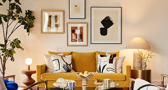 A cozy living room featuring a colorful painting hanging on the wall, with comfortable furniture arranged around the space.